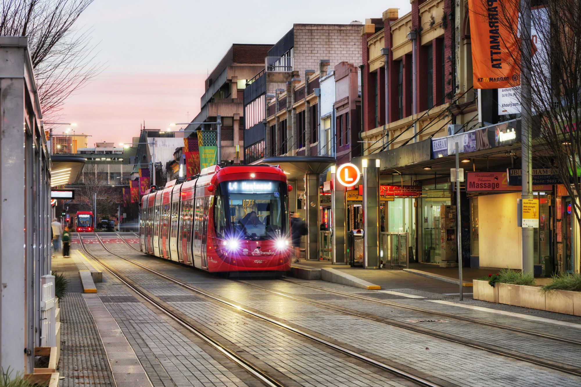 Light rail on a Parramatta street at dusk, NSW